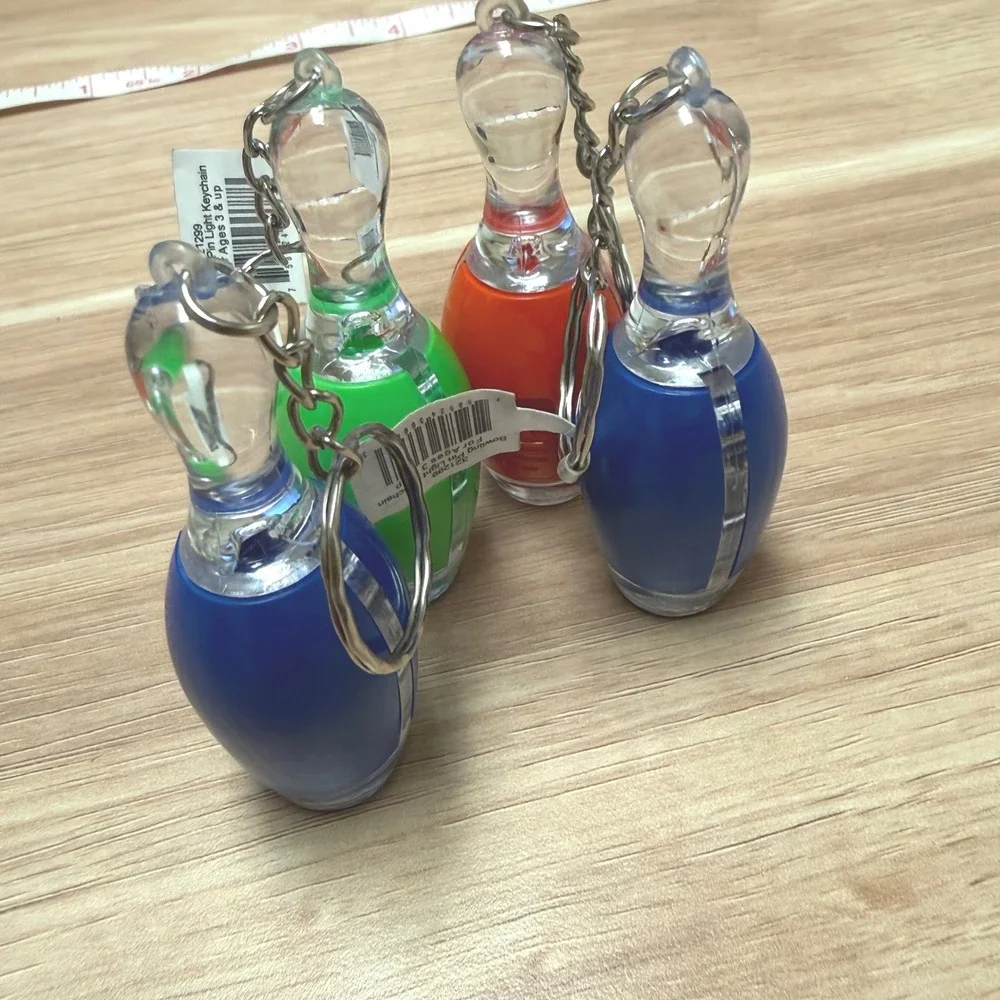 Set of 4 Bowling Pin Light Up LED Keychains Blue Green Orange Novelty